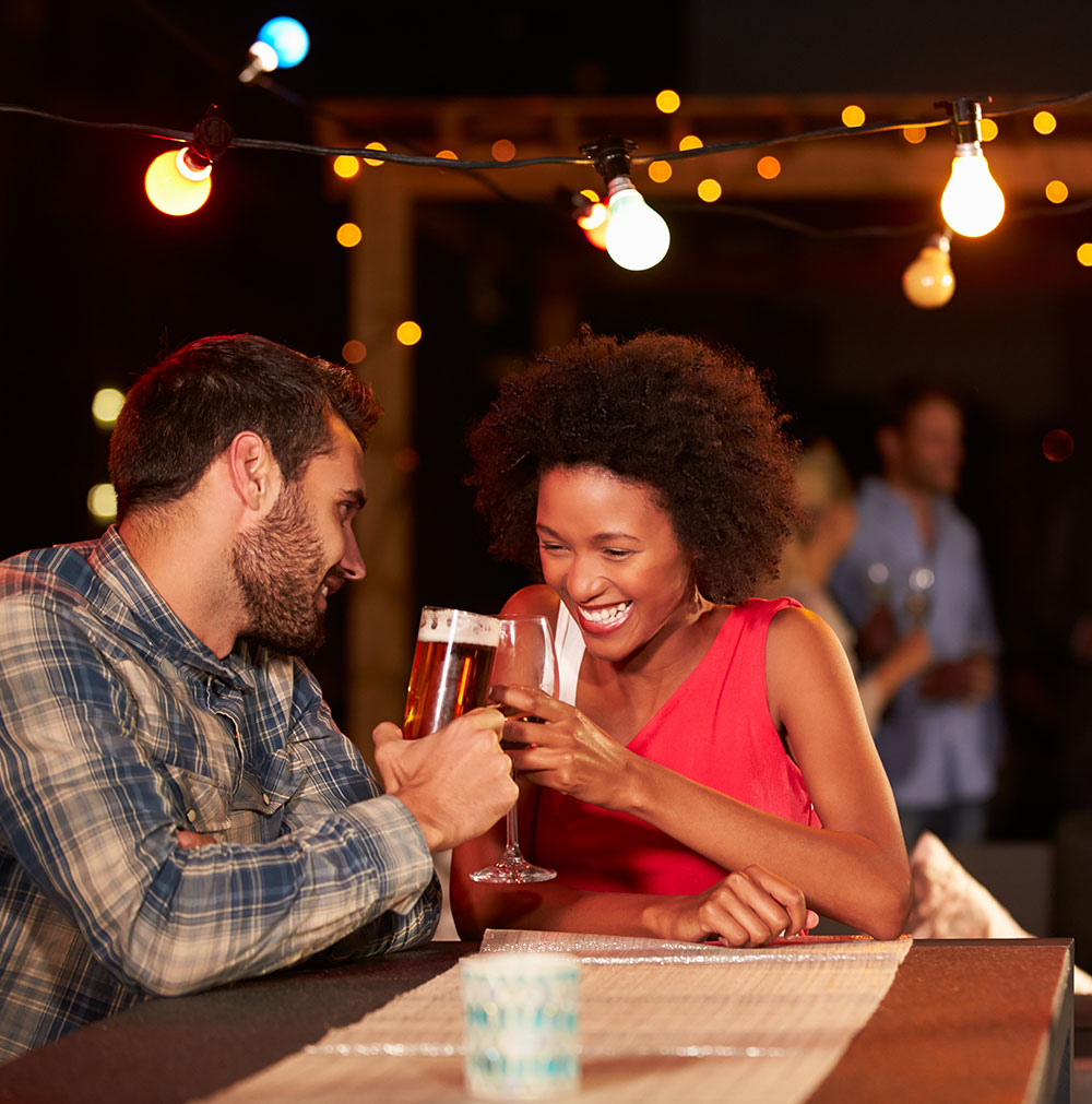 Two people having a quiet drink at a singles event